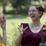 Bride & bridesmaid/sister laughing